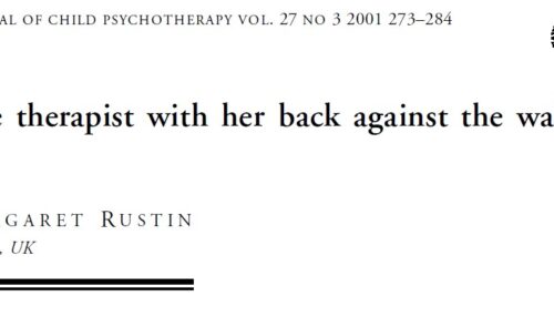 The therapist with her back against the wall